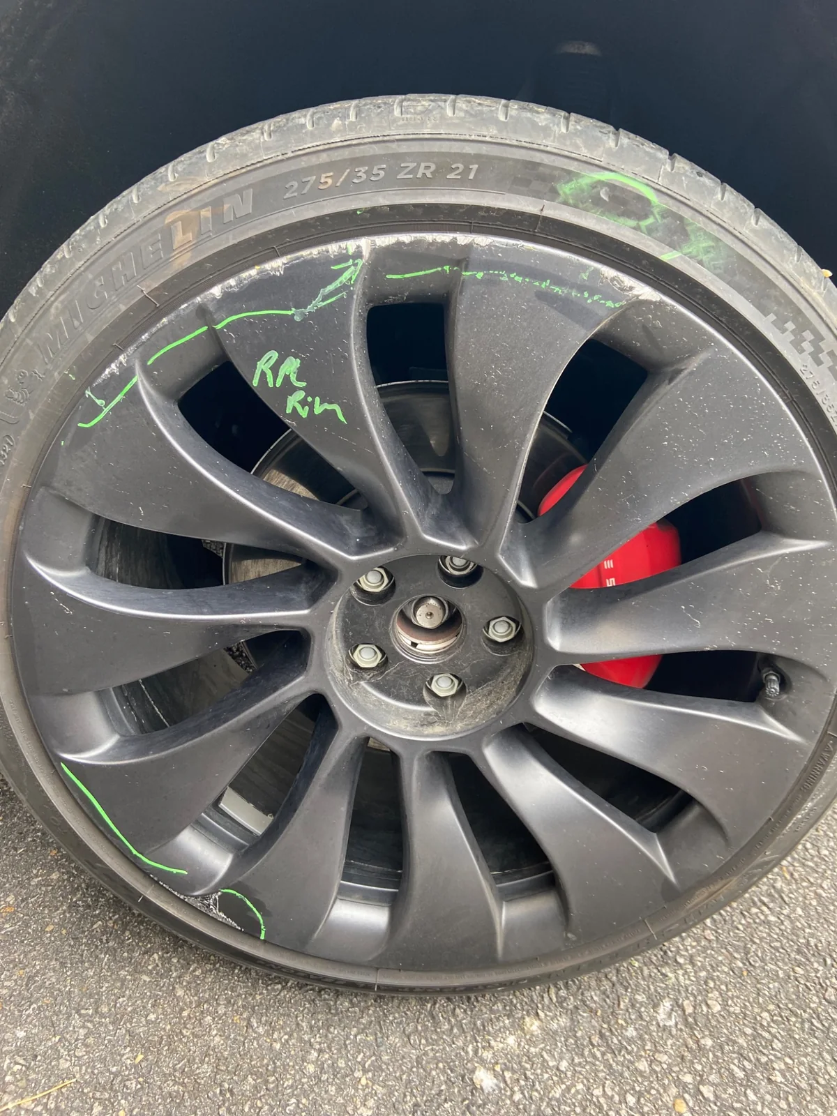 Tesla wheel before repair